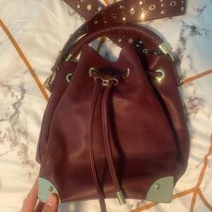 Cute purse, bucket style with detachable strap, studded leather, burgundy color
